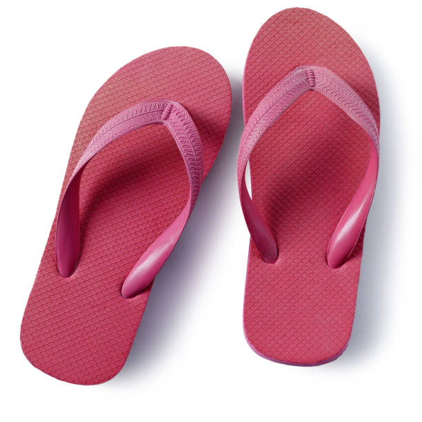 istock Red flipflops beach sandals isolated on white background 987366710