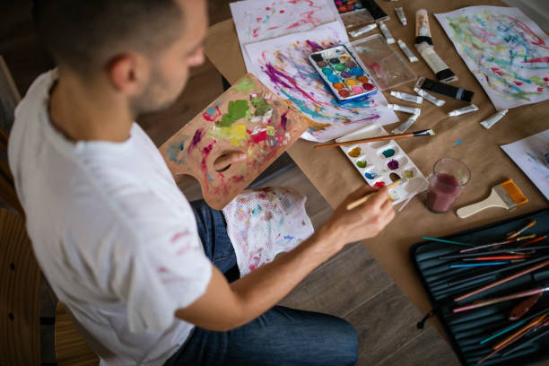 istock Young artist mixing colors 987370820