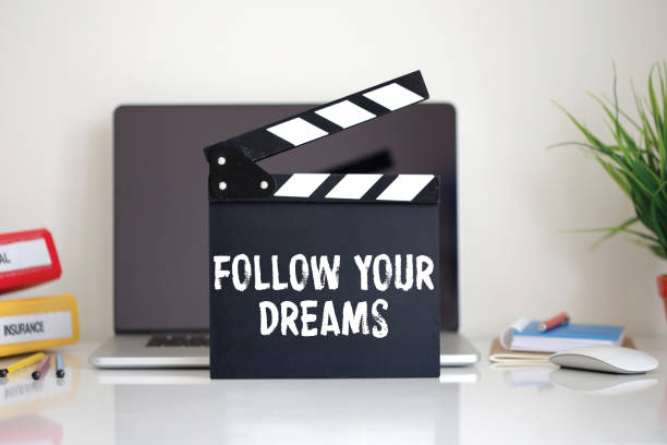 istock Cinema Clapper with Follow Your Dreams word 987371154