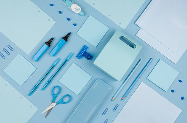 istock Blue office stationery collection on soft pastel blue paper  background, top view. 987380522