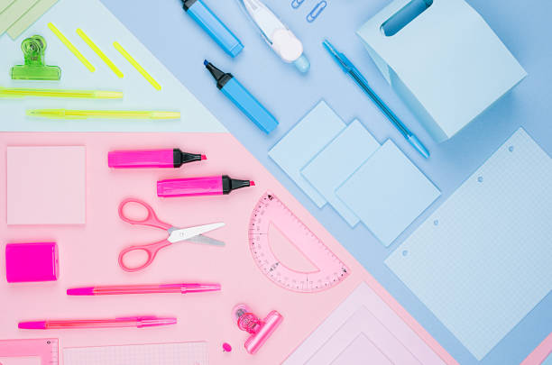 istock Concept art stationery background for designers - colored office accessories on soft light blue, pink, neon mint backdrop. 987382976