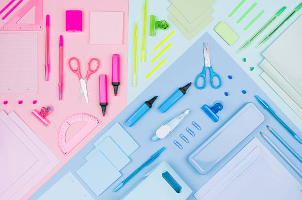 istock Neon pastel multicolor stationery set as art pattern on blue, pink, yellow background, flat lay. 987383168