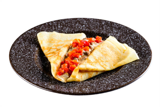 istock Delicious pancake blini with meat and pepper isolated on white b 987383650
