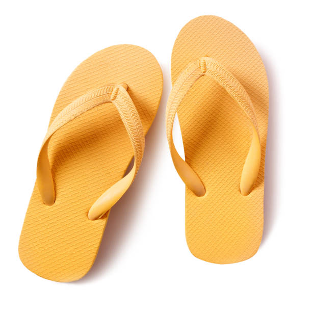 istock Flip flop beach shoes yellow isolated on white background 987383656