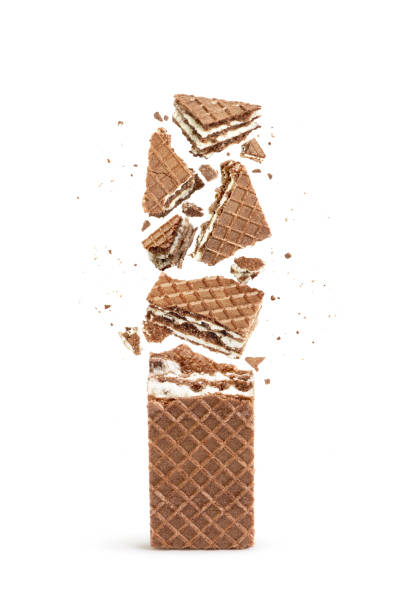 istock Waffles broken into pieces, isolated on a white background 987388216