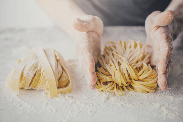 istock Chef making traditional italian homemade pasta 987388442