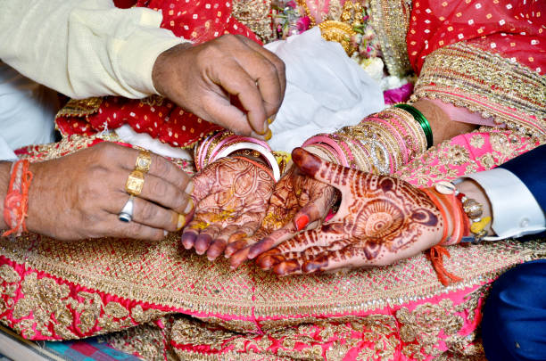 istock Hindu Rituals haldi on bride's hands havan phere 987388992
