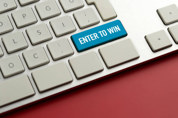 istock Computer key showing the word ENTER TO WIN 987389236