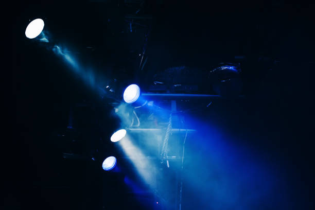 istock Blue scenic spot lights, beams and smoke 987389316