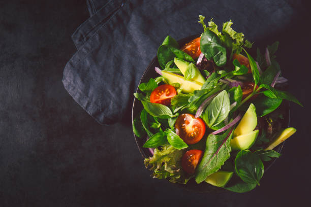 istock Detox tasty salad on dark table 987394298