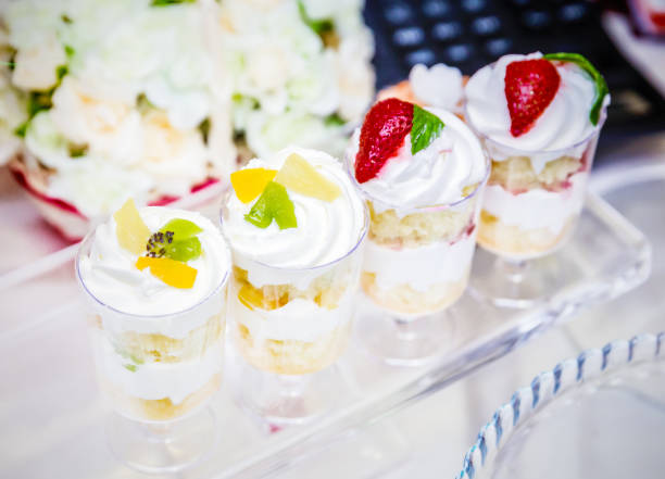 istock Mini cakes with fresh berries and vanilla cream 987402892
