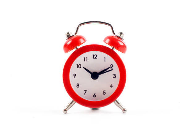 istock Alarm clock isolated on white background 987408188