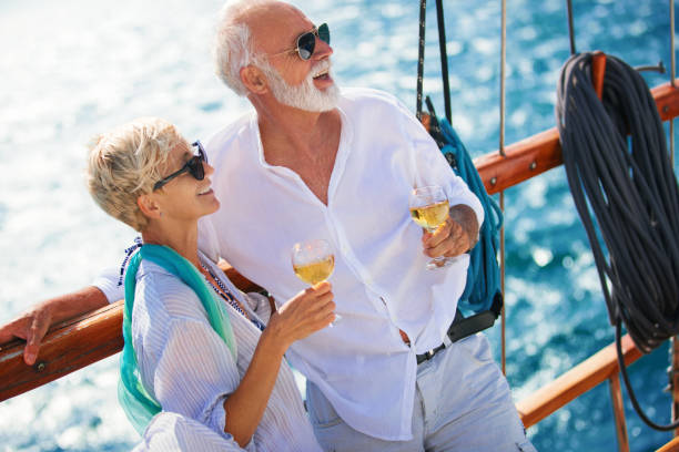 istock Senior couple on a sailing cruise. 987411926