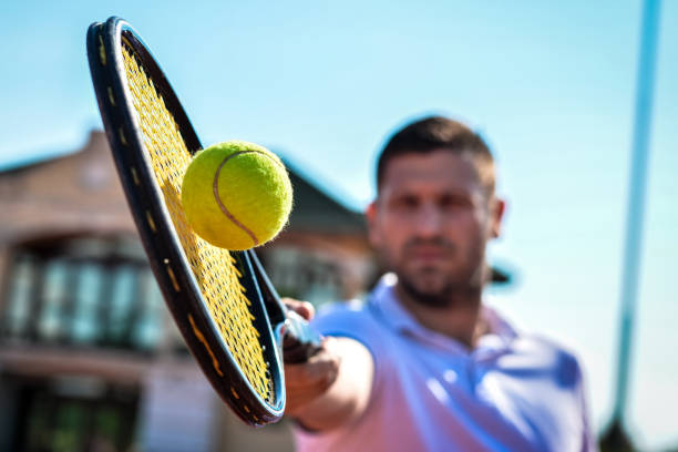 istock Young man playing tennis 987412354