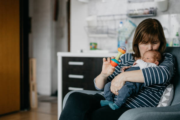 istock Grandmother embracing her grandson 987439466