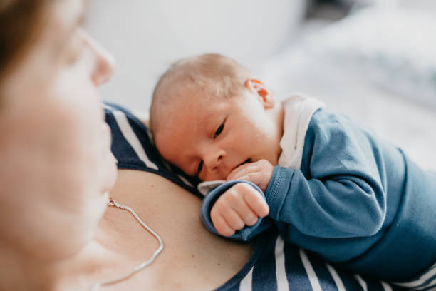 istock Grandmother holding her grandchild 987442014