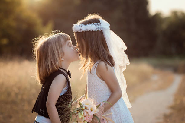 istock Cute little bride and groom 987451308