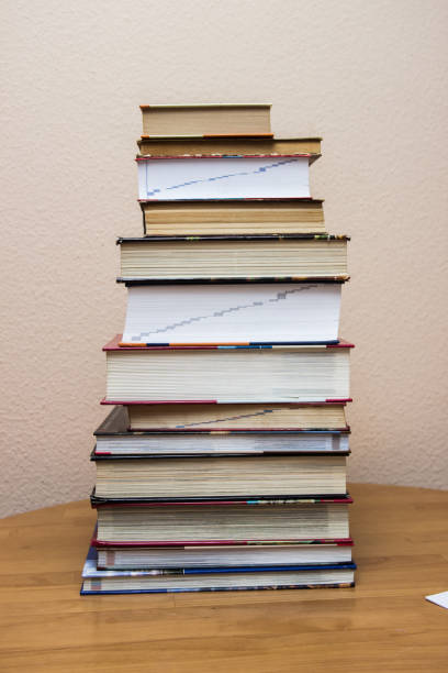 istock piles of books on the table. 987452220