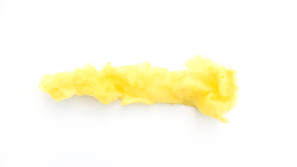 istock Yellow cotton candy on a white background. 987459592