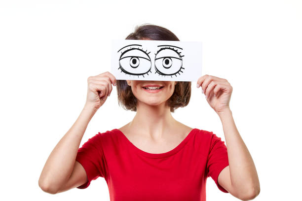 funny woman holding funny cartoon eyes