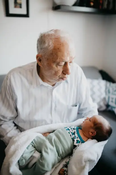 Great-grandfather holding his  great grandson