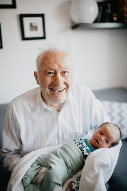 Great-grandfather holding his  great grandson