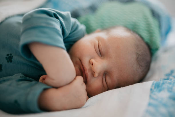 istock Newborn baby sleeping peacefully 987490282