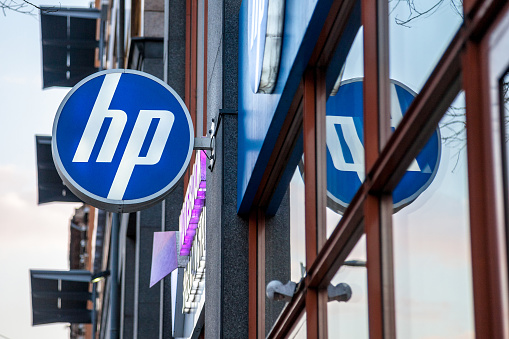 Picture of an HP Shop sign on their main store in Budapest, Hungary. HP, formerly Hewlett Packard, is an American technology company which develops personal computers (PCs), printers and related supplies, as well as 3D solutions