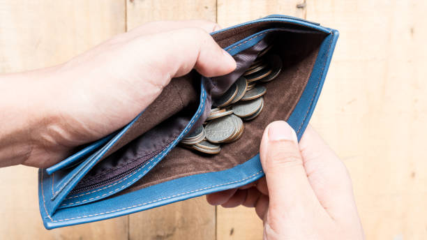 istock Wallet empty and no money hold in his hand 987531772