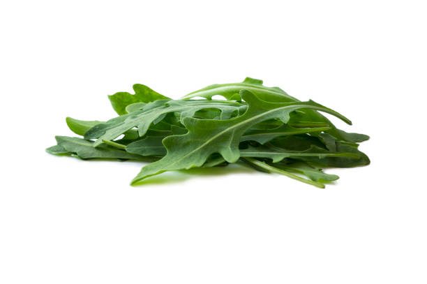 istock Fresh arugula salad isolated on white background. Top view. Fresh arugula leaves with copy space for text. Ruccola leaf isolated on white background on white background. 987539470