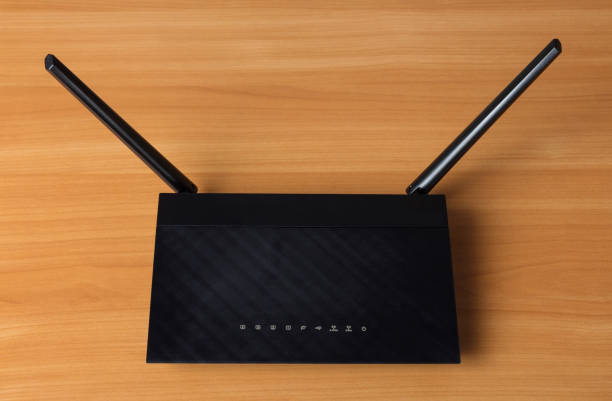 istock Wi-Fi router to connect multiple devices to local Internet, on table 987544476