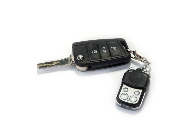istock Car key with garage remote control on the white 987544586