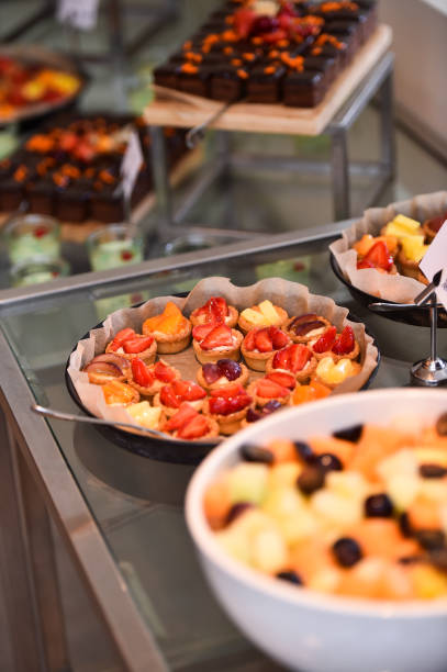 istock Catering service with delicious deserts and fruit tarts 987544954