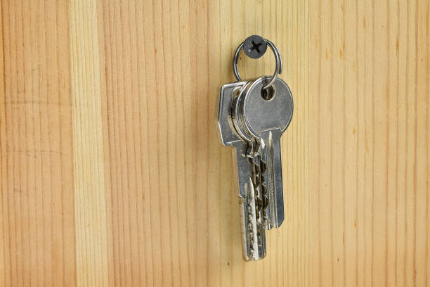 istock Hanging keys on the wooden wall 987552688