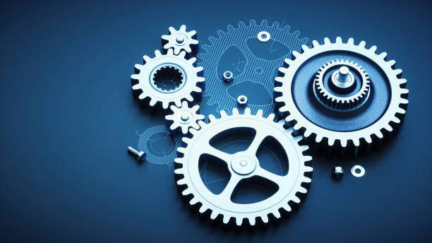 istock Gears setup on blueprint with nuts & bolts, top view. 987562744