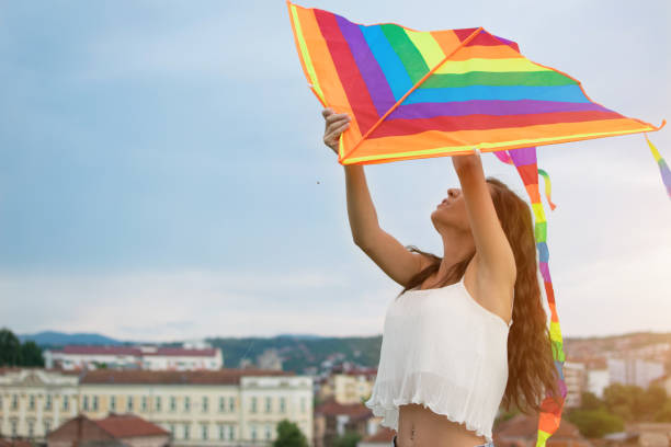 istock Happy girl launching kites 987563782