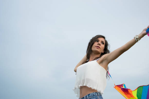 istock Happy girl launching kites 987564138