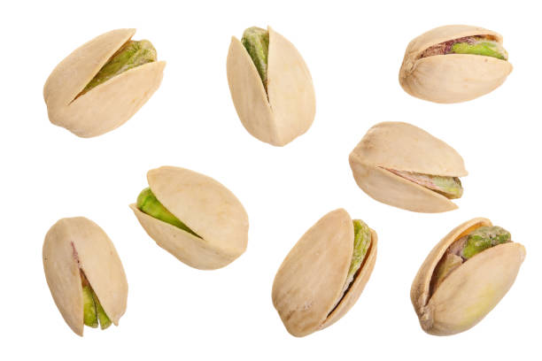 istock Pistachios isolated on white background, top view. Flat lay 987568250