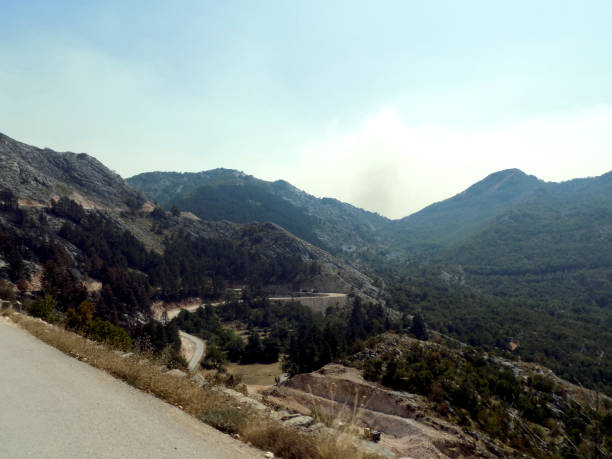 istock Look from above on the mountain road under construction 987577568