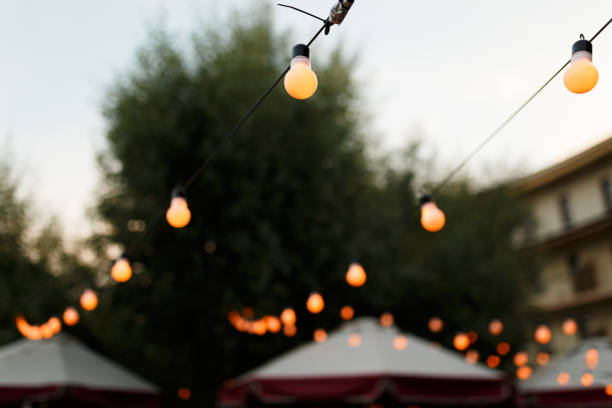 istock warm light bulbs at the evening event 987584712