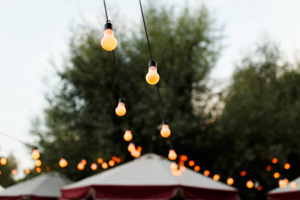 istock warm light bulbs at the evening event 987584794