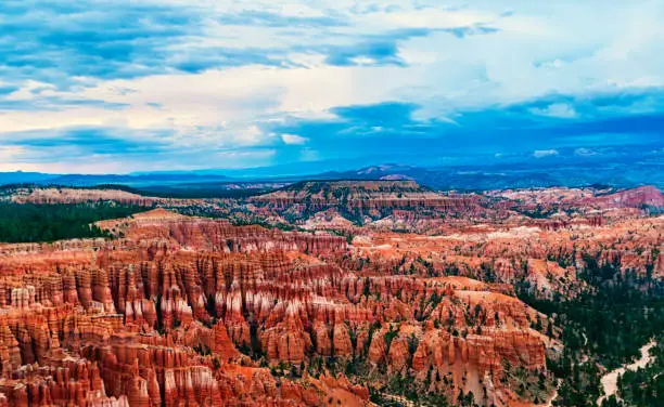 View over the famous Bryce Canyon at sunset, Utah, USA. Bryce Canyon is a collection of giant natural amphitheaters with red, orange and white rocks
