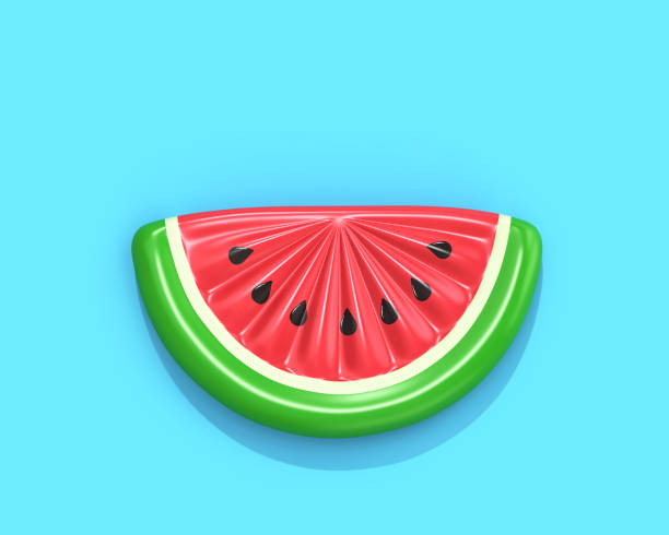 aufblasbare wassermelone slice auf blauem hintergrund - float stock-fotos und bilder