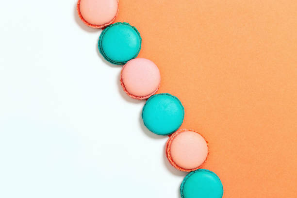 istock Row of mint and pink macarons. 987606152