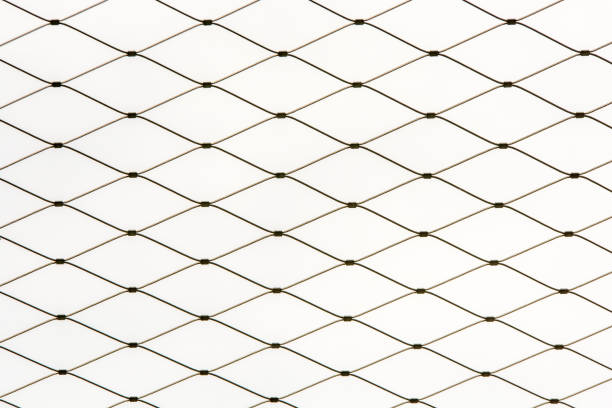 Pattern of wire mesh of a fence in front of white background
