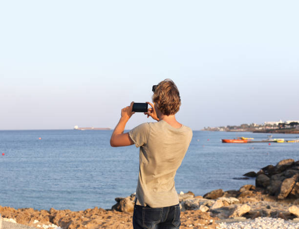 istock Teenage boy using smart phone.Selfie 987623034