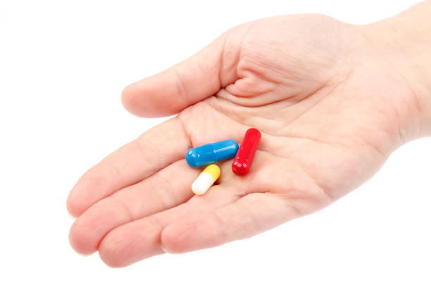 istock Drugs in hand on a white background 987627210