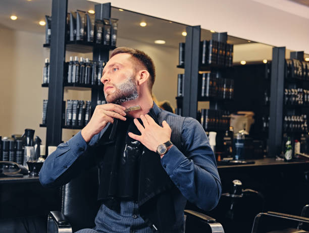 istock A man shaving himself in a saloon. 987628722