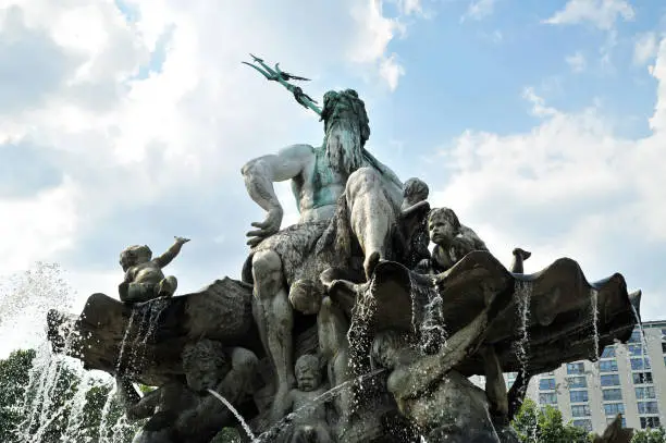 Berlin, neptune fountain, blue sky with clouds