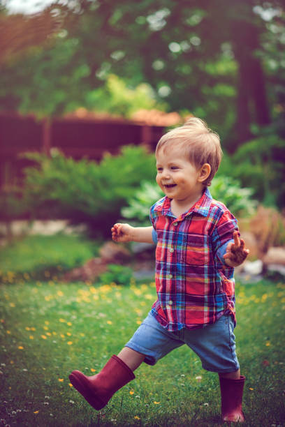 istock Happy child walking in the garden 987632612